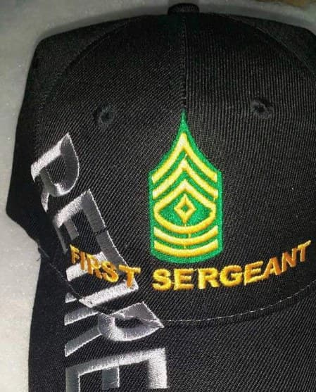 Black cap embroidered with First Sergeant chevrons and the words Retired First Sergeant