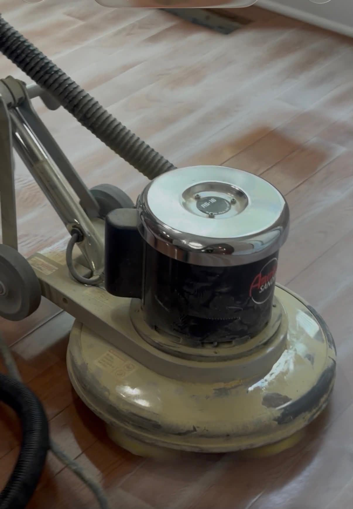 Floor buffer working across a hardwood floor