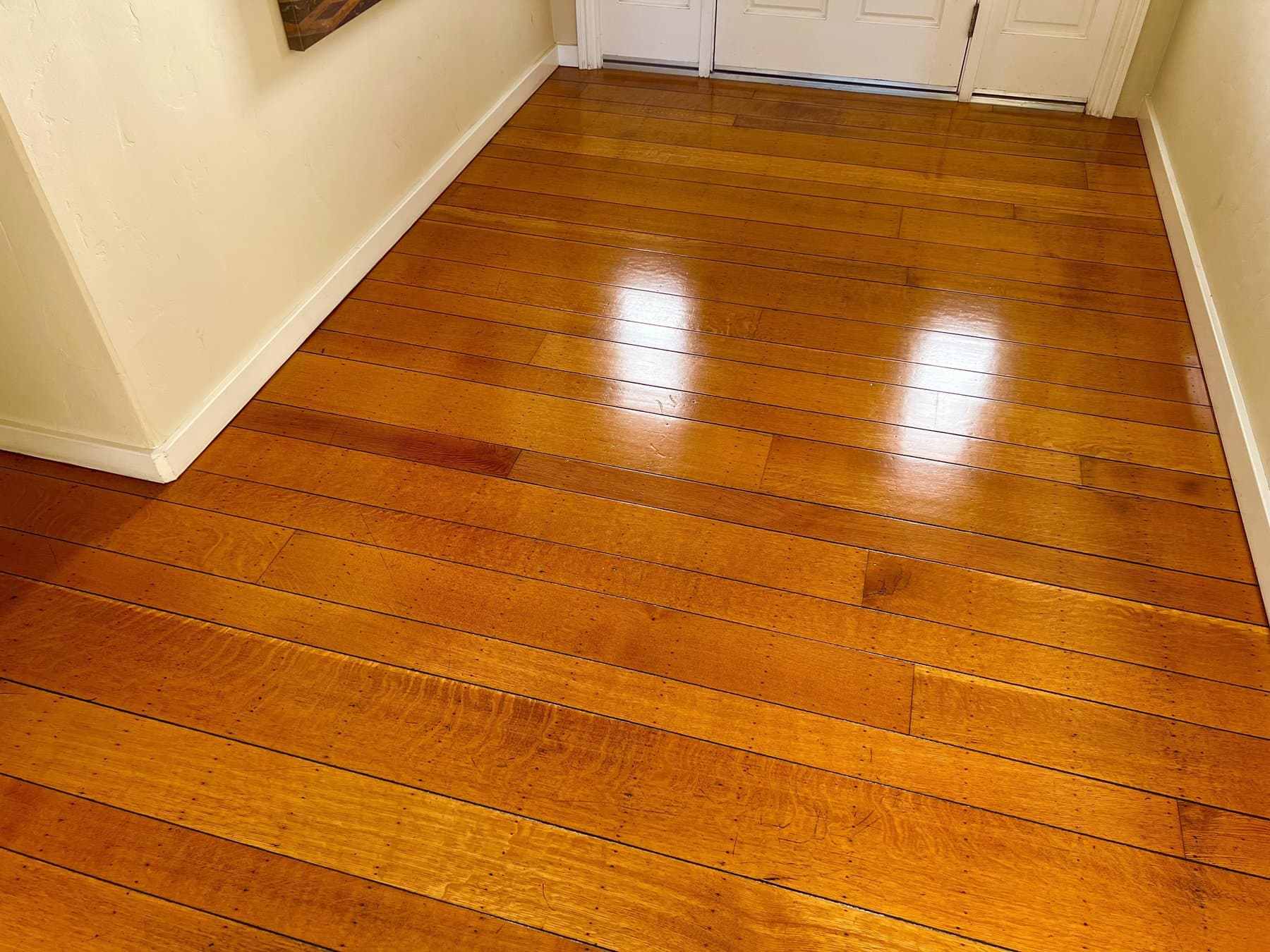 Before and after screen and recoat hardwood floor restoration